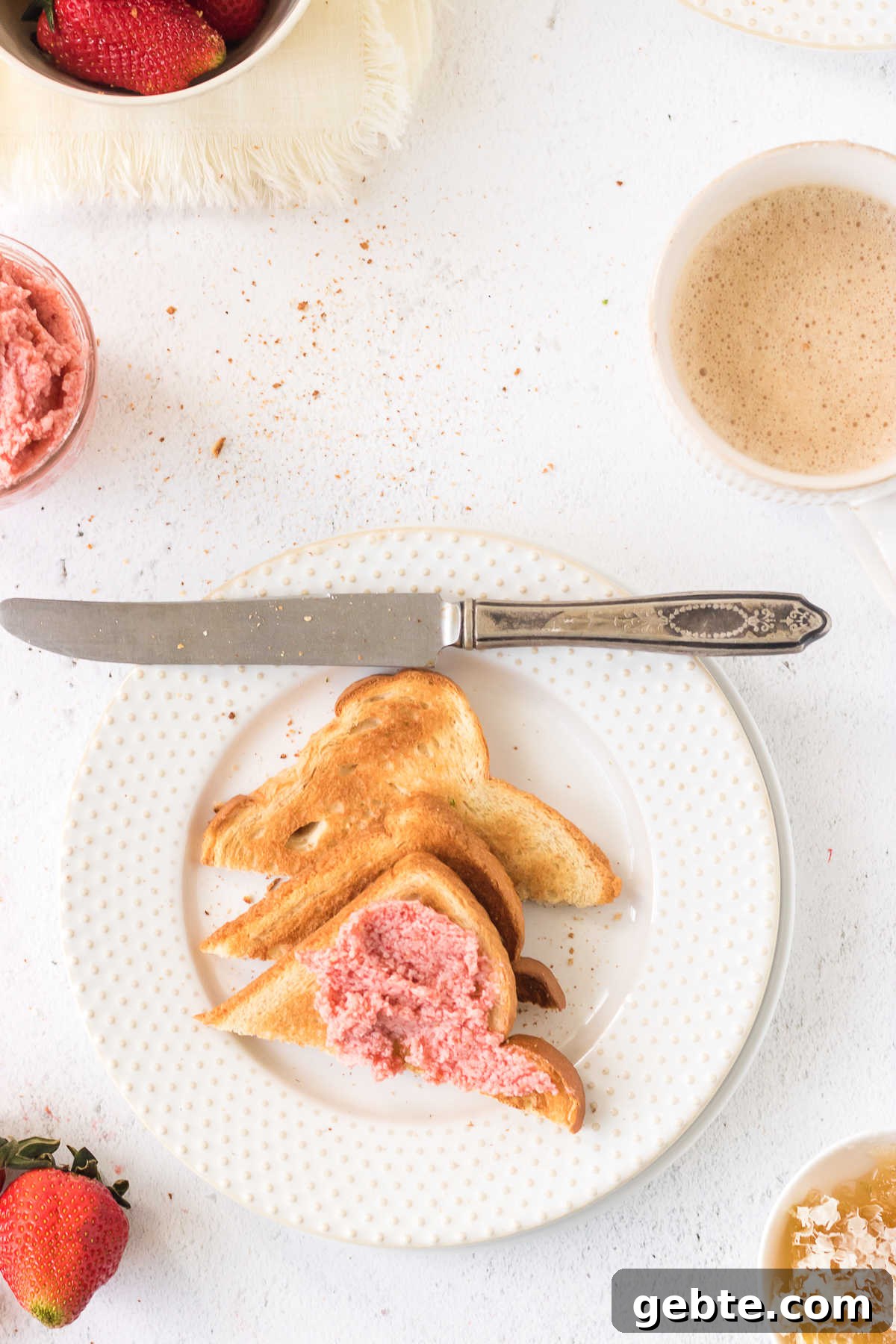 Overhead view of strawberry butter on toast.