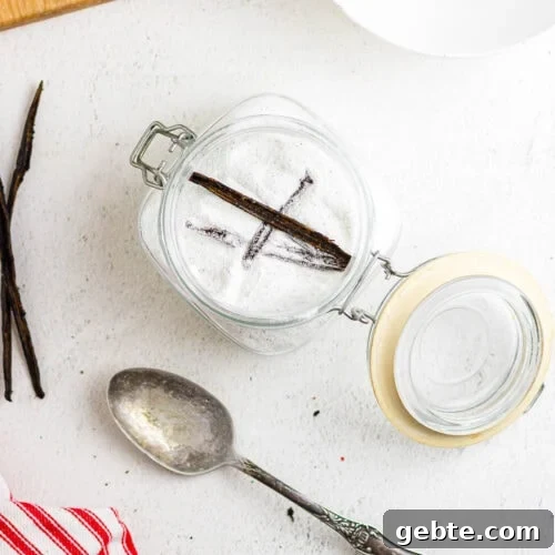 Overhead view of vanilla sugar in a storage container.
