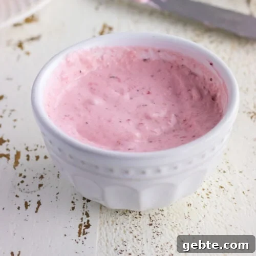 Closeup of strawberry cream cheese for the featured image.