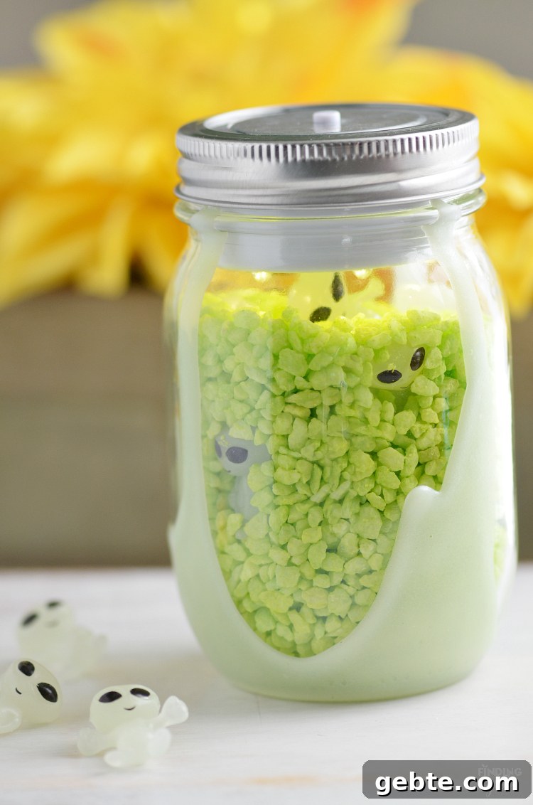 Make Your Own Alien Nightlight: DIY Guide for Cool Space Decor 2 DIY Alien Nightlight made from a mason jar with glow-in-the-dark paint and green filler.