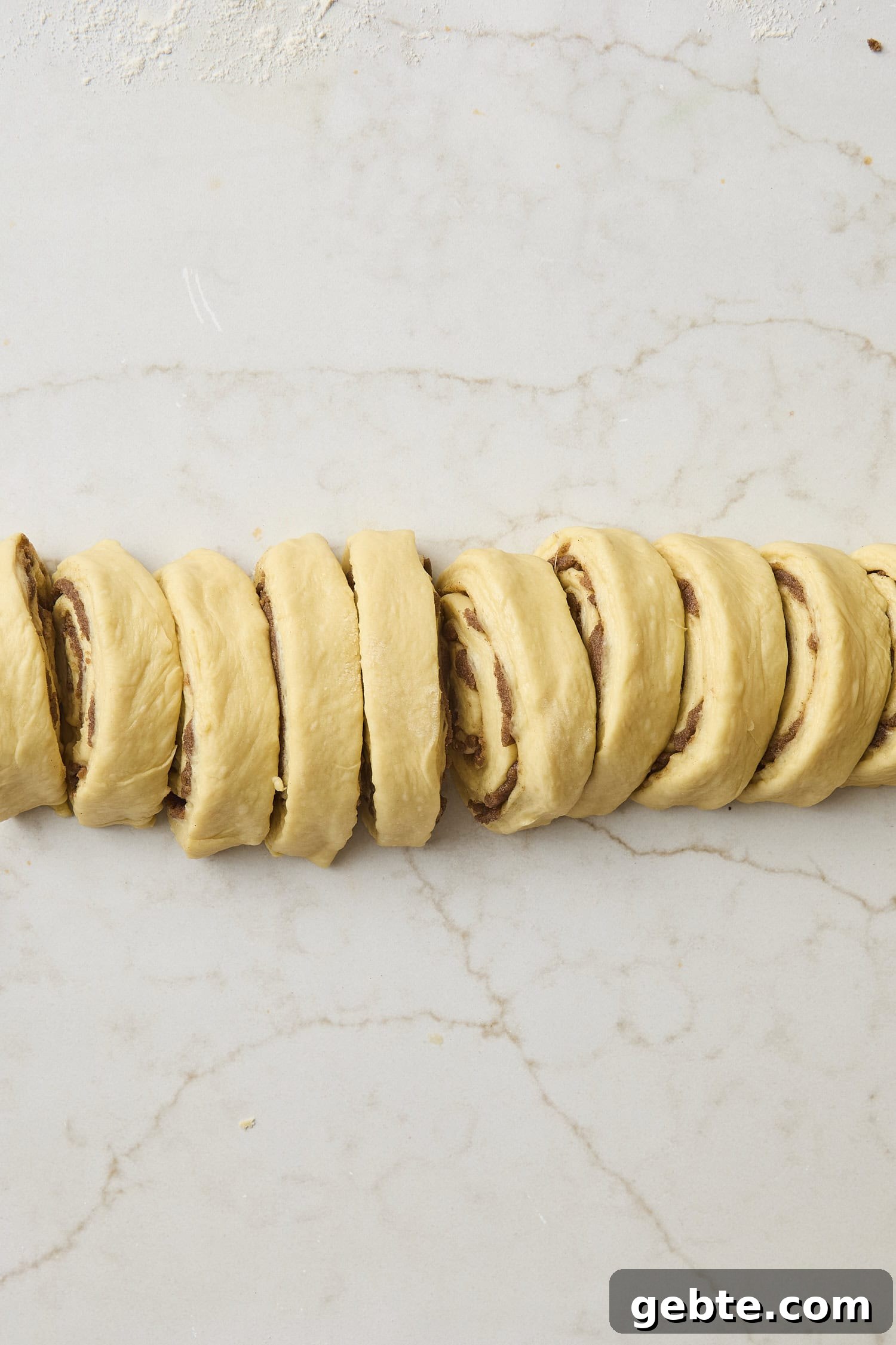 Sliced cinnamon roll dough.
