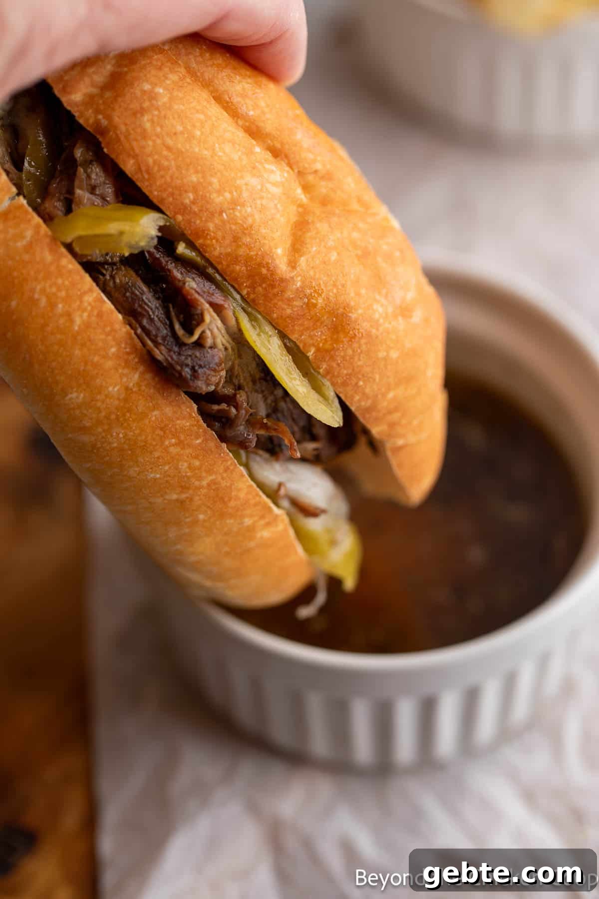 Dipping a sandwich into au jus. 