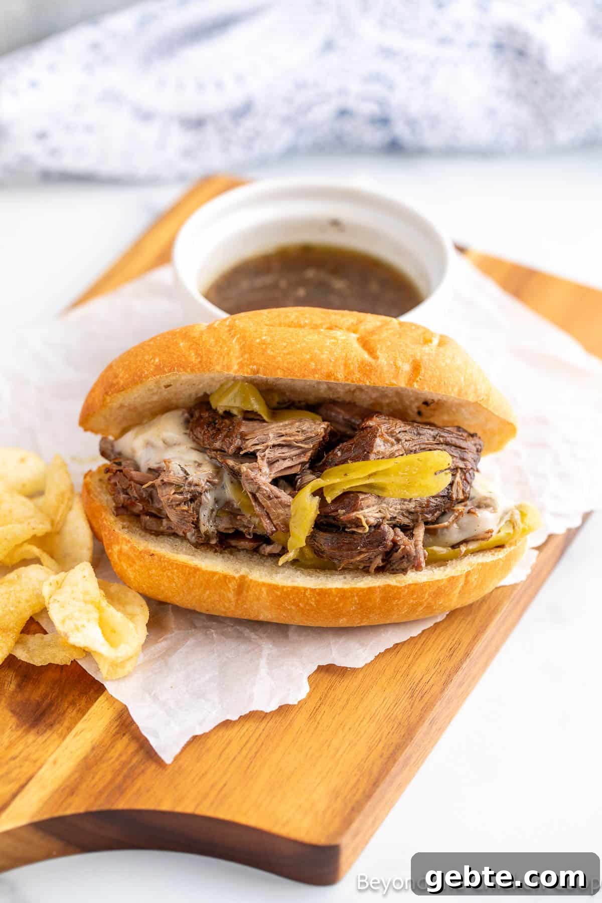 An Italian beef sandwich on a board. 