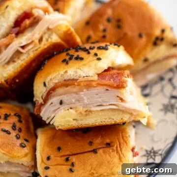 A pile of Turkey Bacon Sliders on a plate.