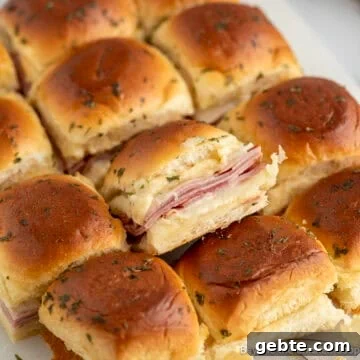 Ham and Cheese Sliders on a cutting board.