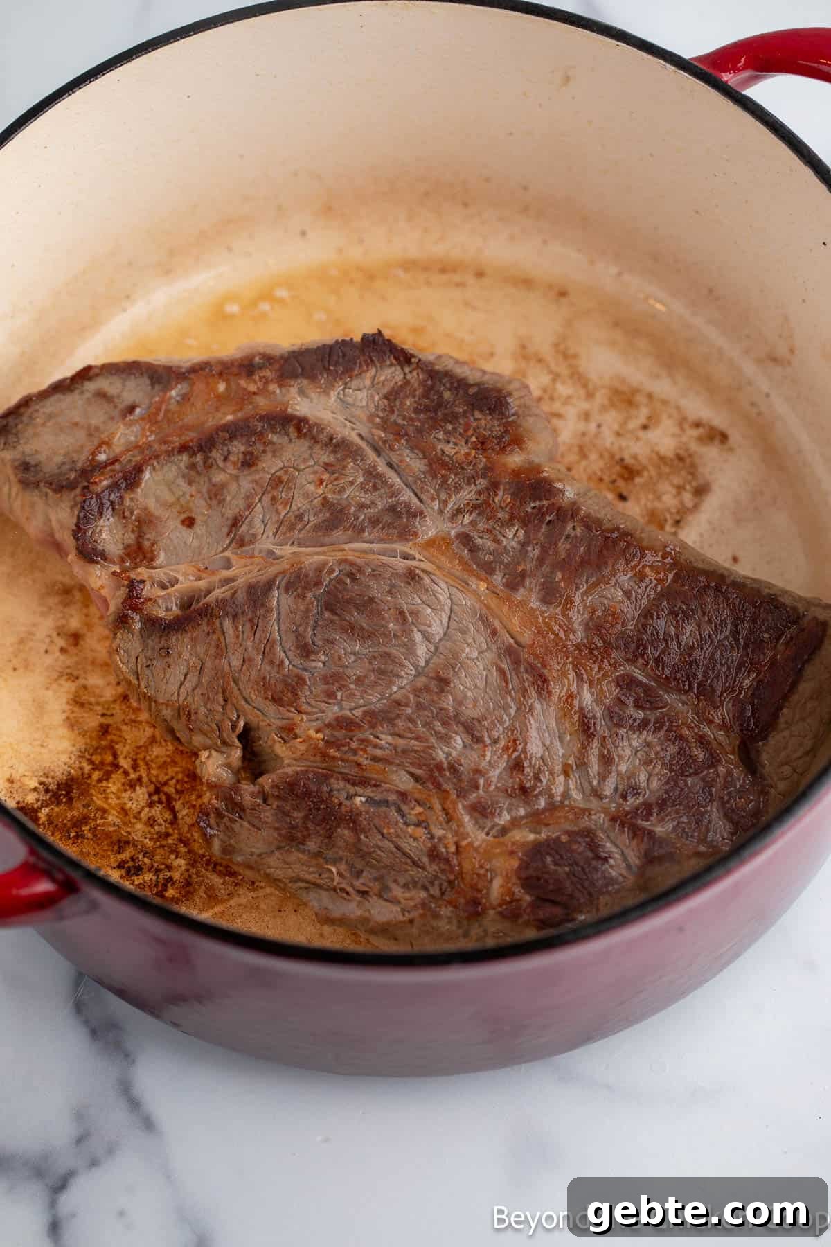 Browning a chuck roast in a pot. 