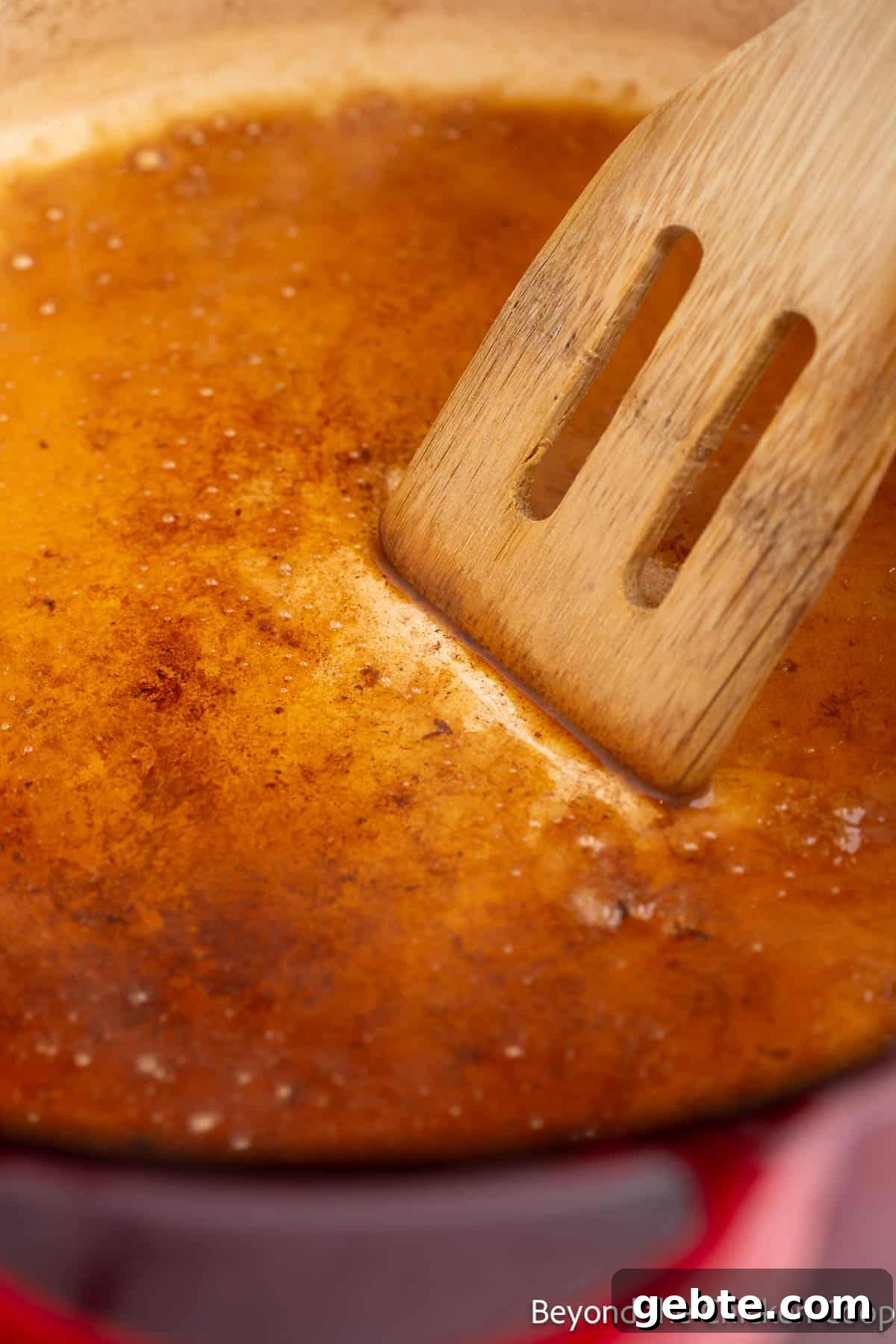 Deglazing a pan with broth. 
