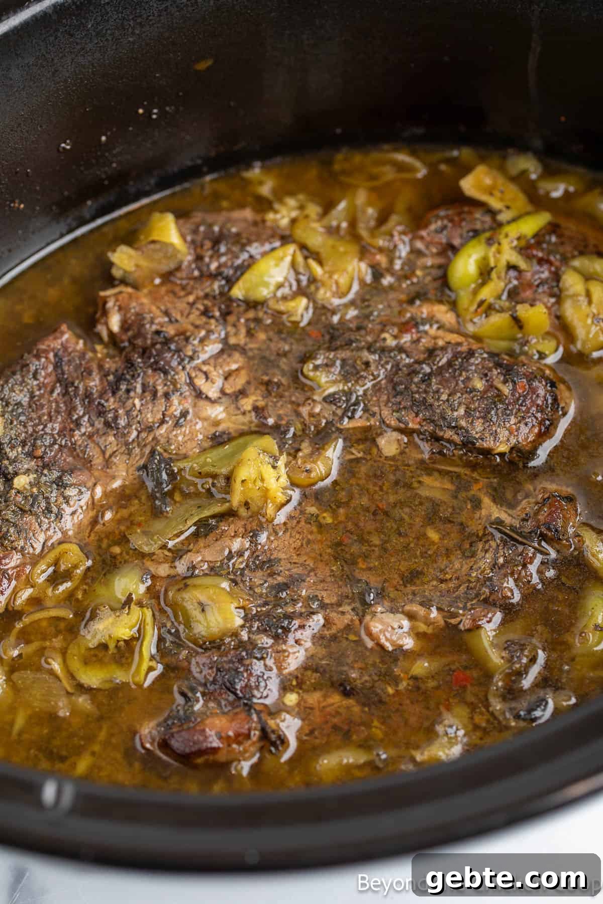 Cooked chuck roast in a crock pot. 