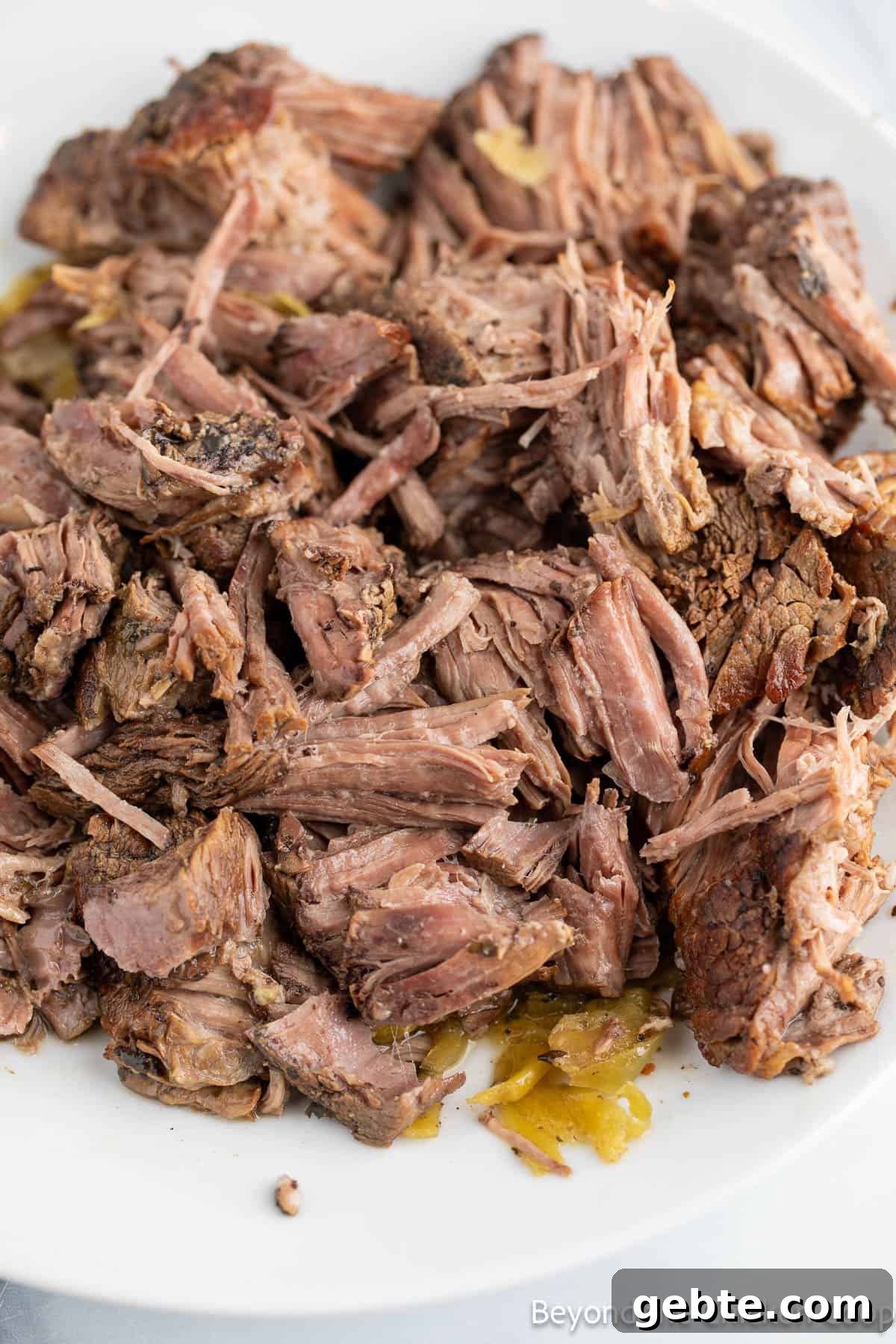 Shredded cooked beef into chunks. 
