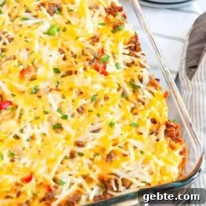 Sausage and Hash Brown Breakfast Casserole Recipe 7 sausage hashbrown breakfast casserole served in a glass casserole dish