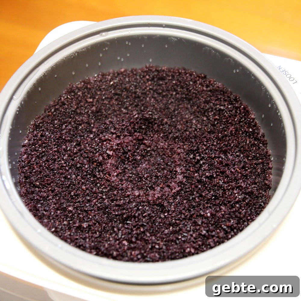 mochi maker will steam and pound the glutinous wild black rice into mochi