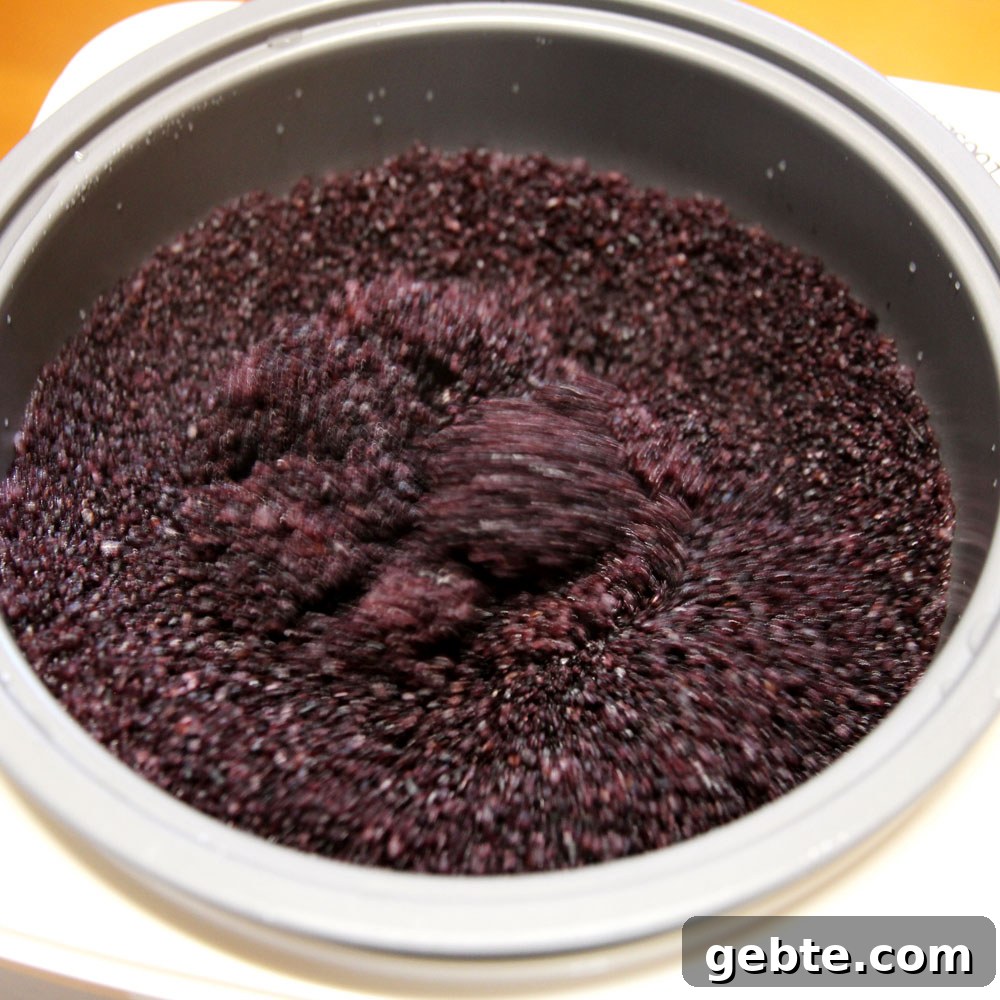 mochi maker will steam and pound the glutinous wild black rice into mochi