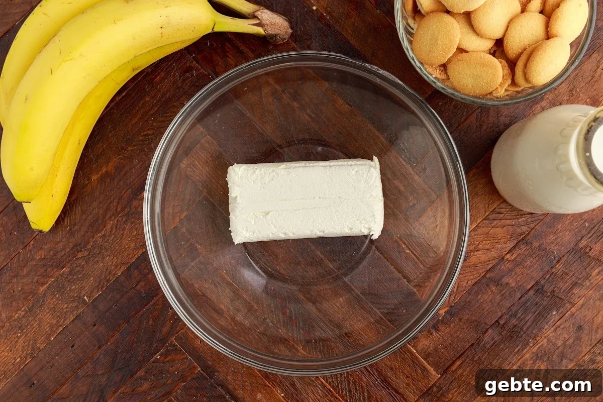 Creamy Banana Pudding Trifle Recipe for Parties and Potlucks 4 Cream cheese in a mixing bowl.