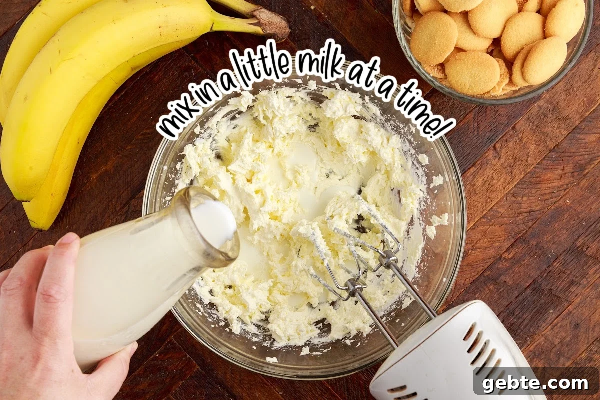 Creamy Banana Pudding Trifle Recipe for Parties and Potlucks 5 Milk added to the cream cheese.