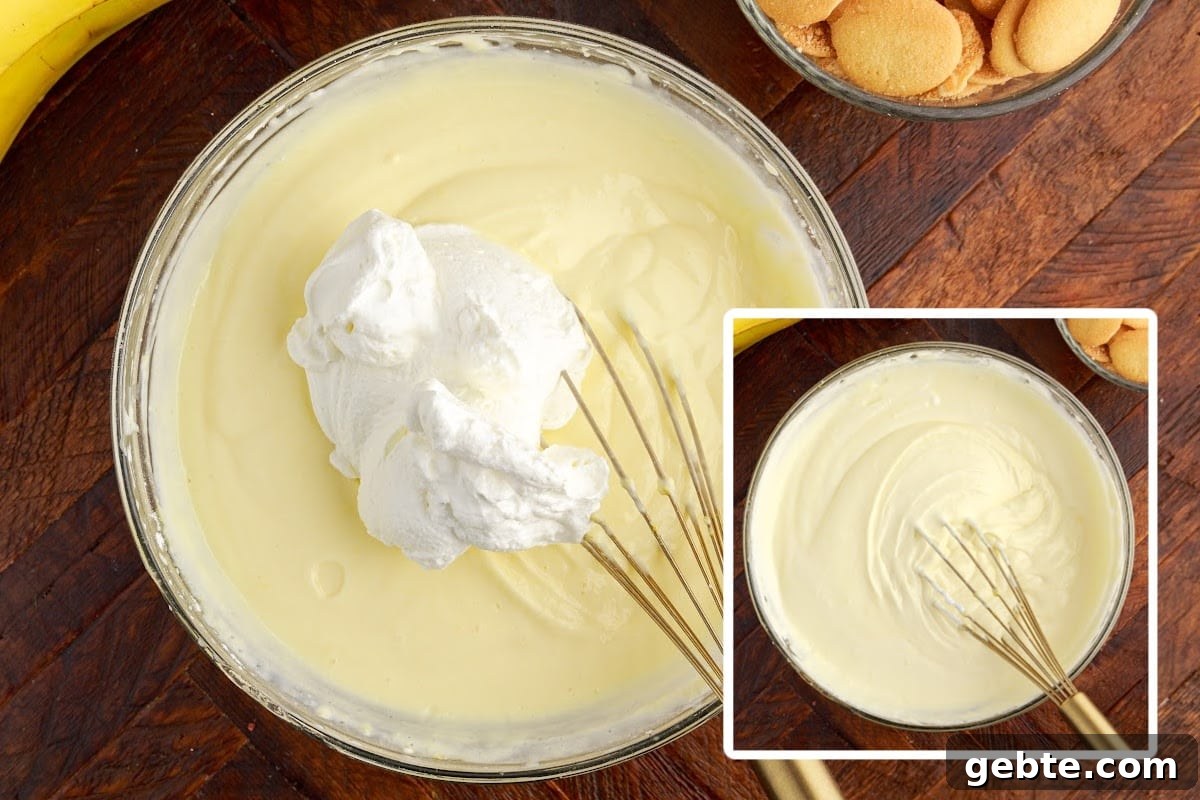 Creamy Banana Pudding Trifle Recipe for Parties and Potlucks 7 Whipped topping added to the pudding mixture.