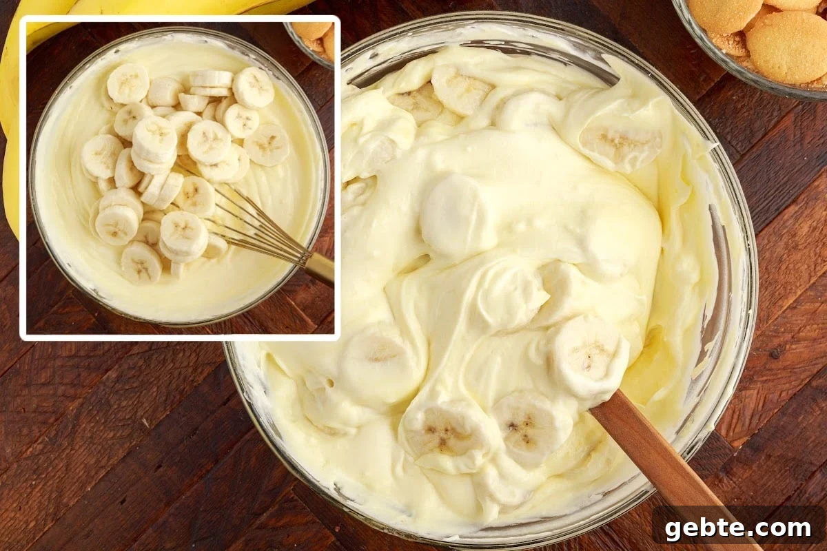 Creamy Banana Pudding Trifle Recipe for Parties and Potlucks 8 Bananas added to the Banana Pudding Trifle and then stirred in.