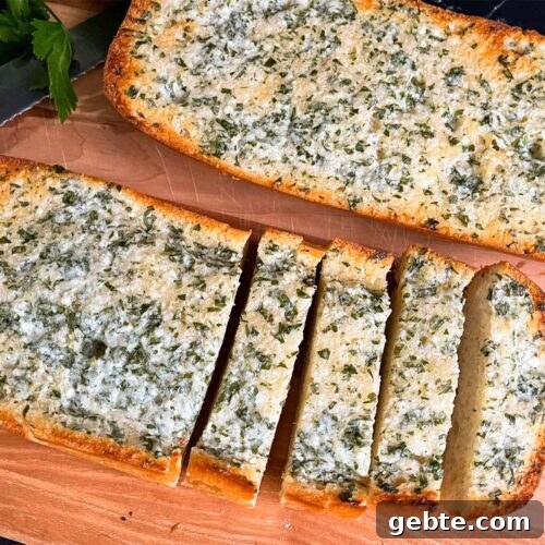 Garlic bread on a cutting board.