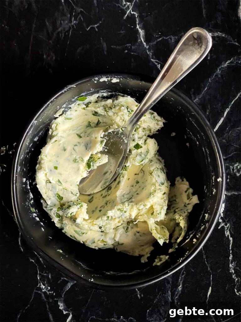 Compound butter in a black bowl.