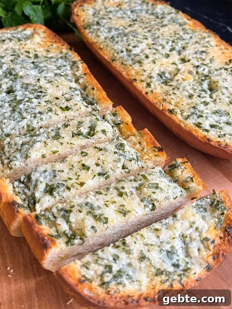 Garlic bread on a cutting board.