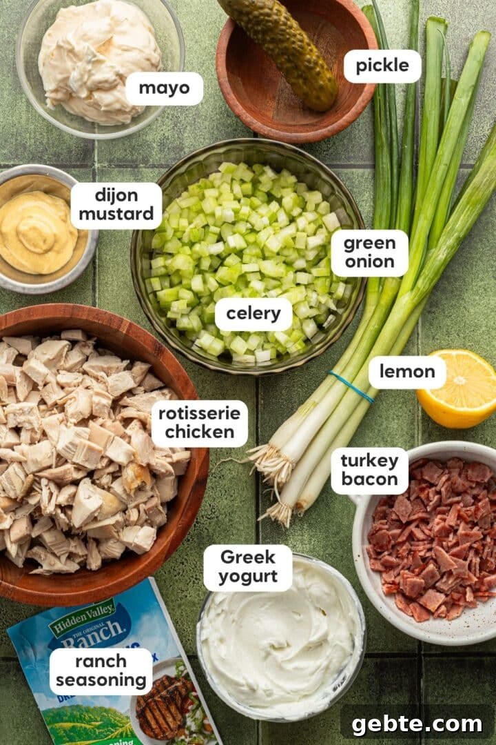 Creamy Ranch Chicken Salad Recipe for Lunch or Meal Prep 3 Ingredients for ranch chicken salad displayed in small bowls on a green tile counter.