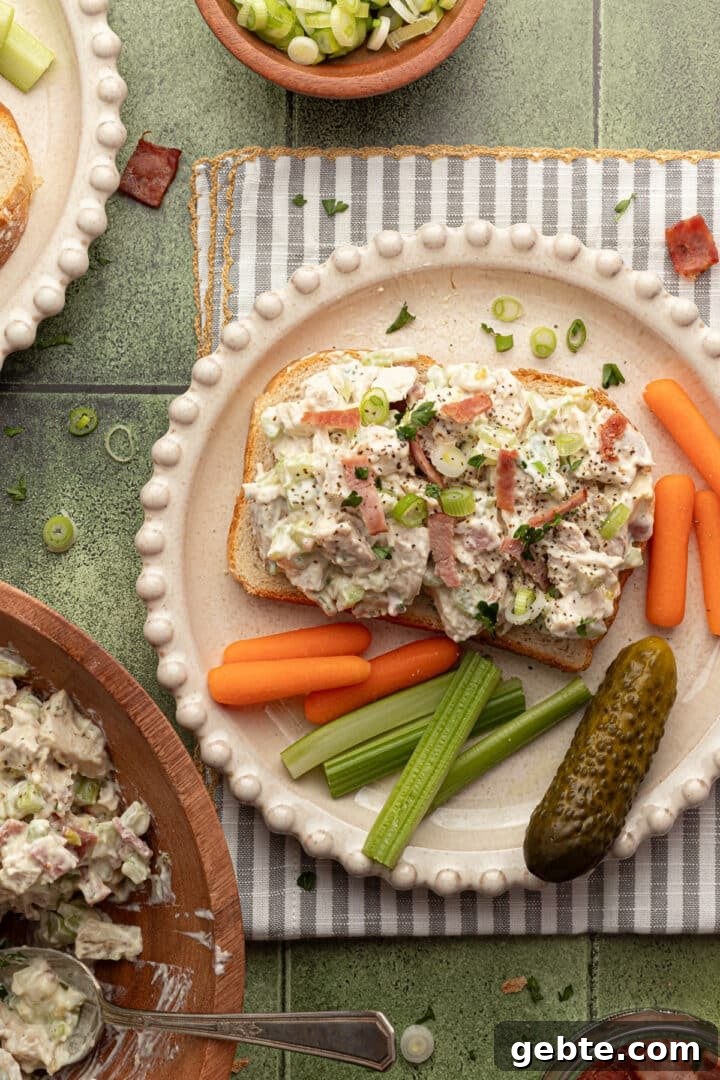 Creamy Ranch Chicken Salad Recipe for Lunch or Meal Prep 6 Ranch chicken salad on open-faced toast, served with sliced veggies and a pickle.
