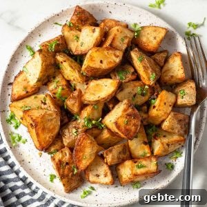 roast potatoes made in the air fryer on a plate with parsley