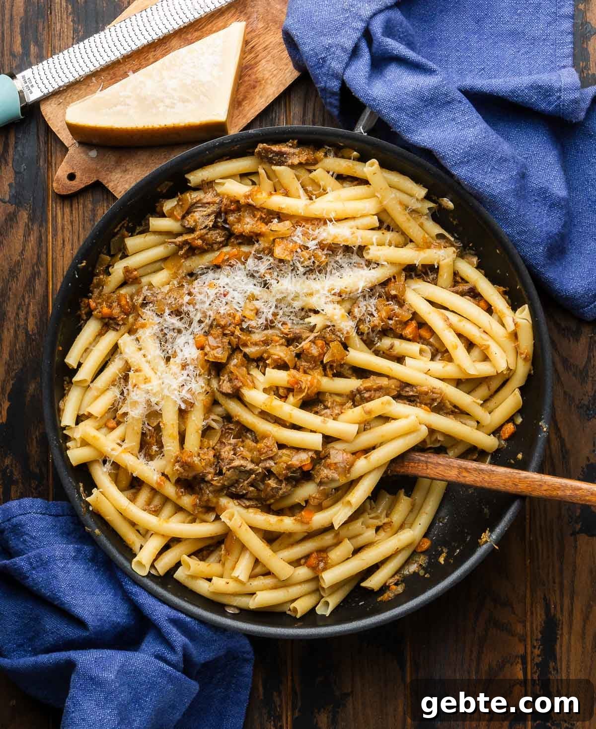 Genovese-Style Pasta with Slow-Cooked Onion Sauce 4 Large black pan with pasta alla Genovese with hand broken long ziti.