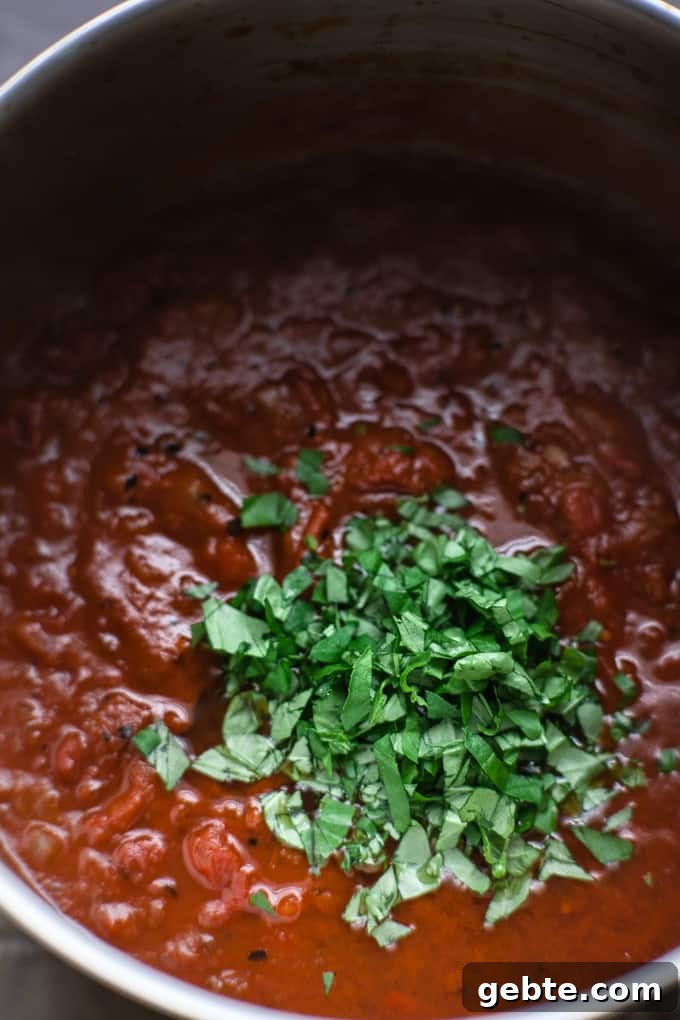 Finished arrabbiata sauce with basil.
