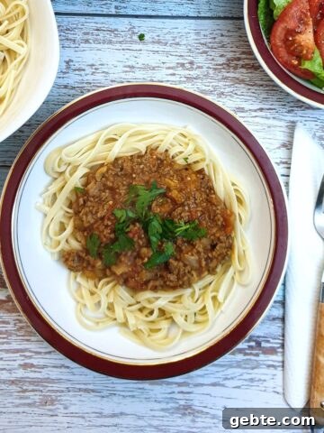 Bolognese sauce on a bed of linguine.