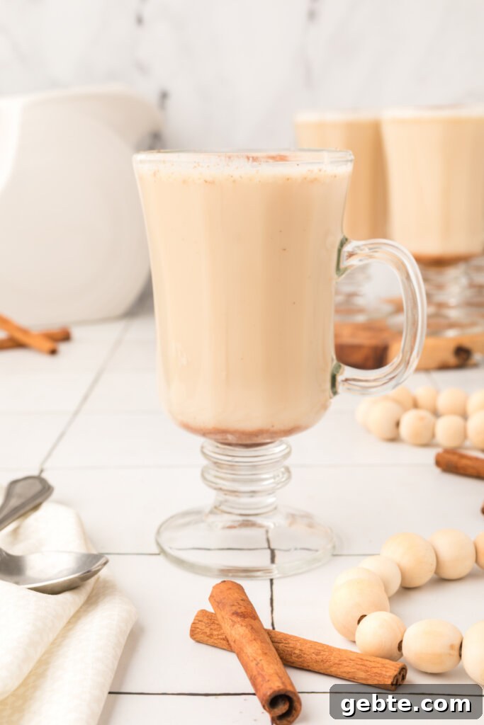 How to Make Hot Buttered Rum Mix at Home 4 looking straight on a glass with hot buttered rum mix