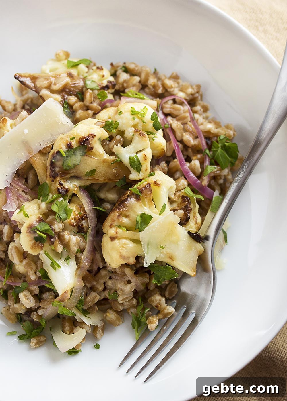 Warm Mediterranean farro salad with pan roasted cauliflower and tahini lemon dressing