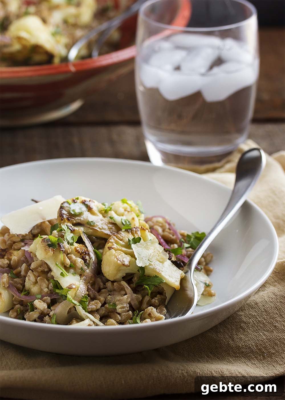 Serving bowl of warm Mediterranean cauliflower and farro salad