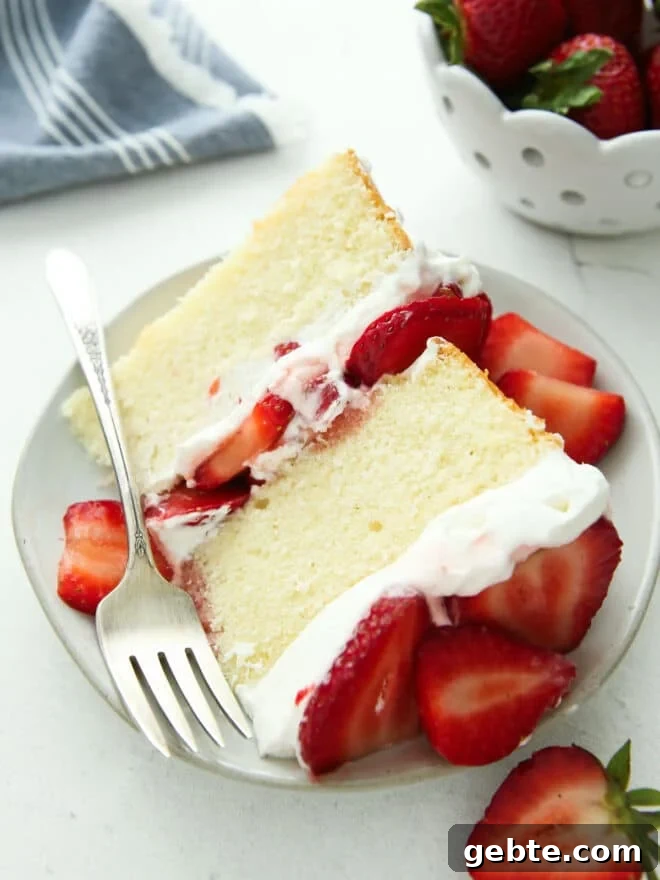 closeup of strawberry shortcake cake slice on a plate