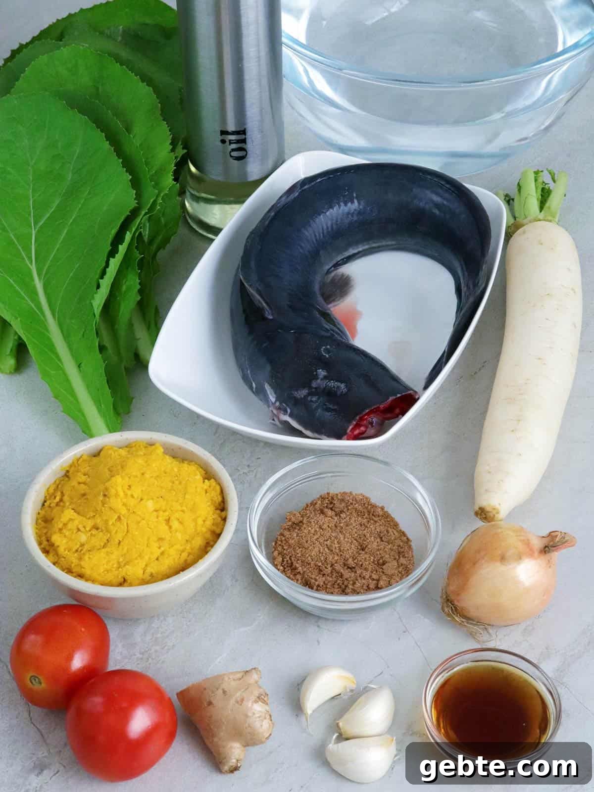 catfish, miso paste, tomatoes, tamarind powder, radish, mustard leaves, fish sauce, onion