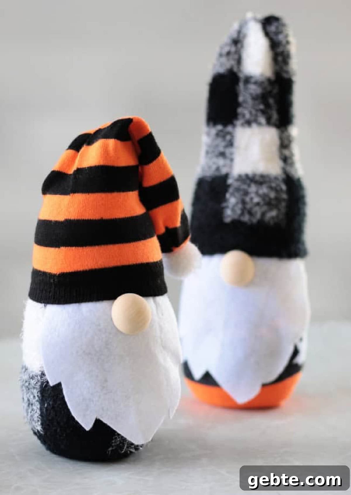 Two sock gnomes on a table.