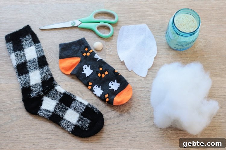 two socks, scissors, bead, stuffing, rice, scissors