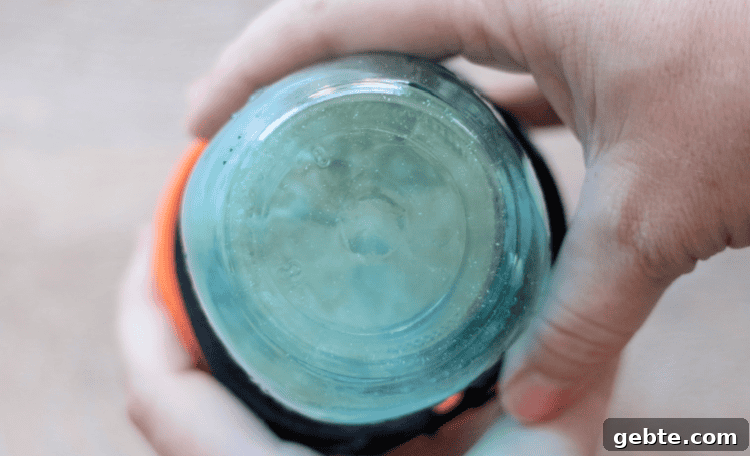 Jar of rice upside down in sock.