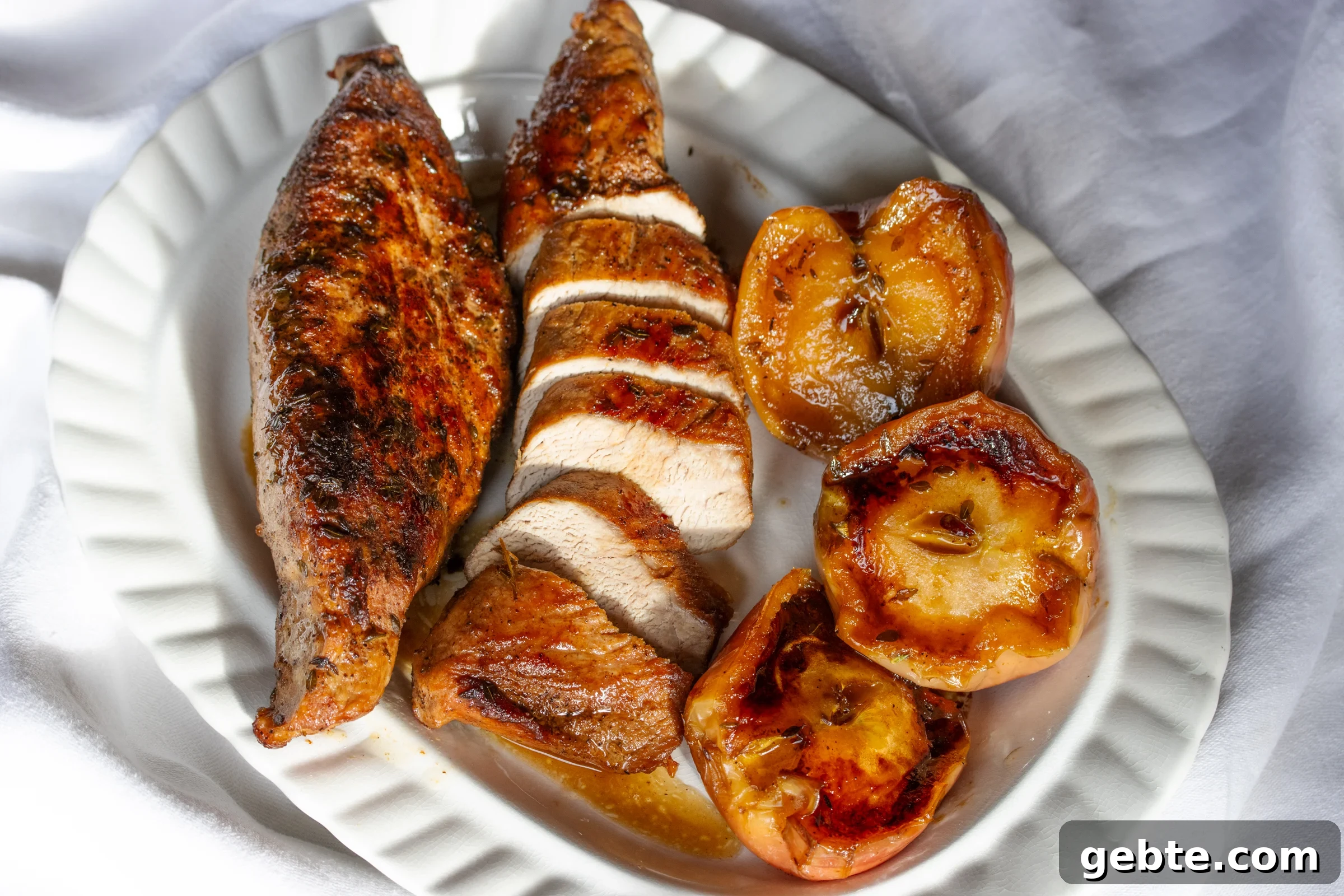 Roasted Pork Tenderloin with Caramelized Apples and Sage 9 The tenderloin is sliced and served with apples.