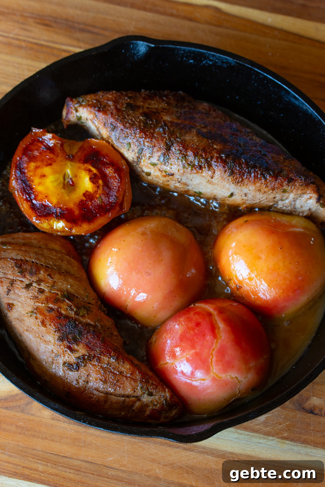 Roasted Pork Tenderloin with Caramelized Apples and Sage 8 Cooked apples with the pork tenderloin in the skillet.