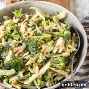 Vegan broccoli slaw in bowl with spoon