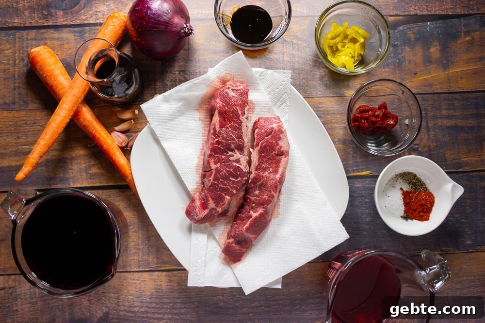 boneless short ribs with ingredients for a braise around it.