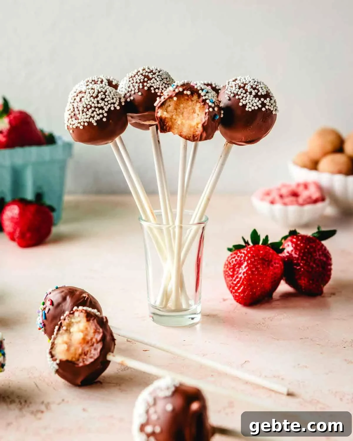 Strawberry Vanilla Cake Pops Recipe for Perfect Party Treats 3 Vanilla cake pops in a small glass.