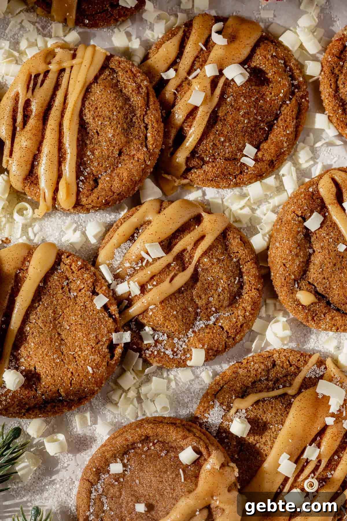 Gingerbread Latte Cookies Recipe — Cozy Spiced Coffee Cookies 11 iced gingerbread latte cookies surrounded by white chocolate curls.