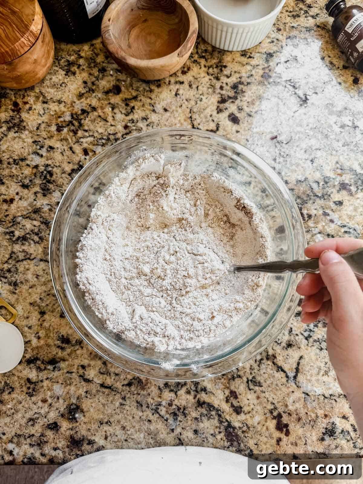 Gingerbread Latte Cookies Recipe — Cozy Spiced Coffee Cookies 5 whisking dry ingredients for gingerbread latte cookies in a glass bowl.