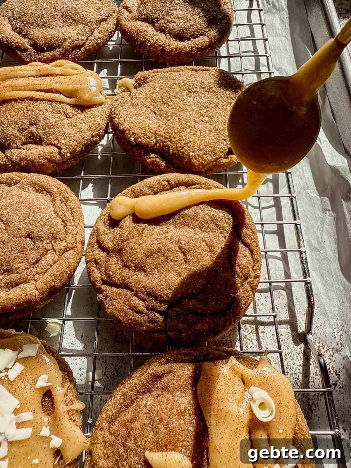 Gingerbread Latte Cookies Recipe — Cozy Spiced Coffee Cookies 10 drizzling a brown butter brown sugar glaze on top of a gingerbread latte cookie.