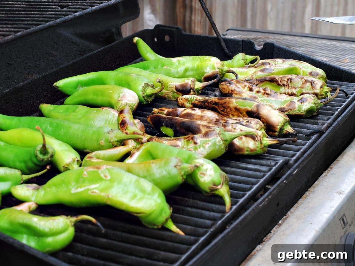 green chiles roasting on a grill