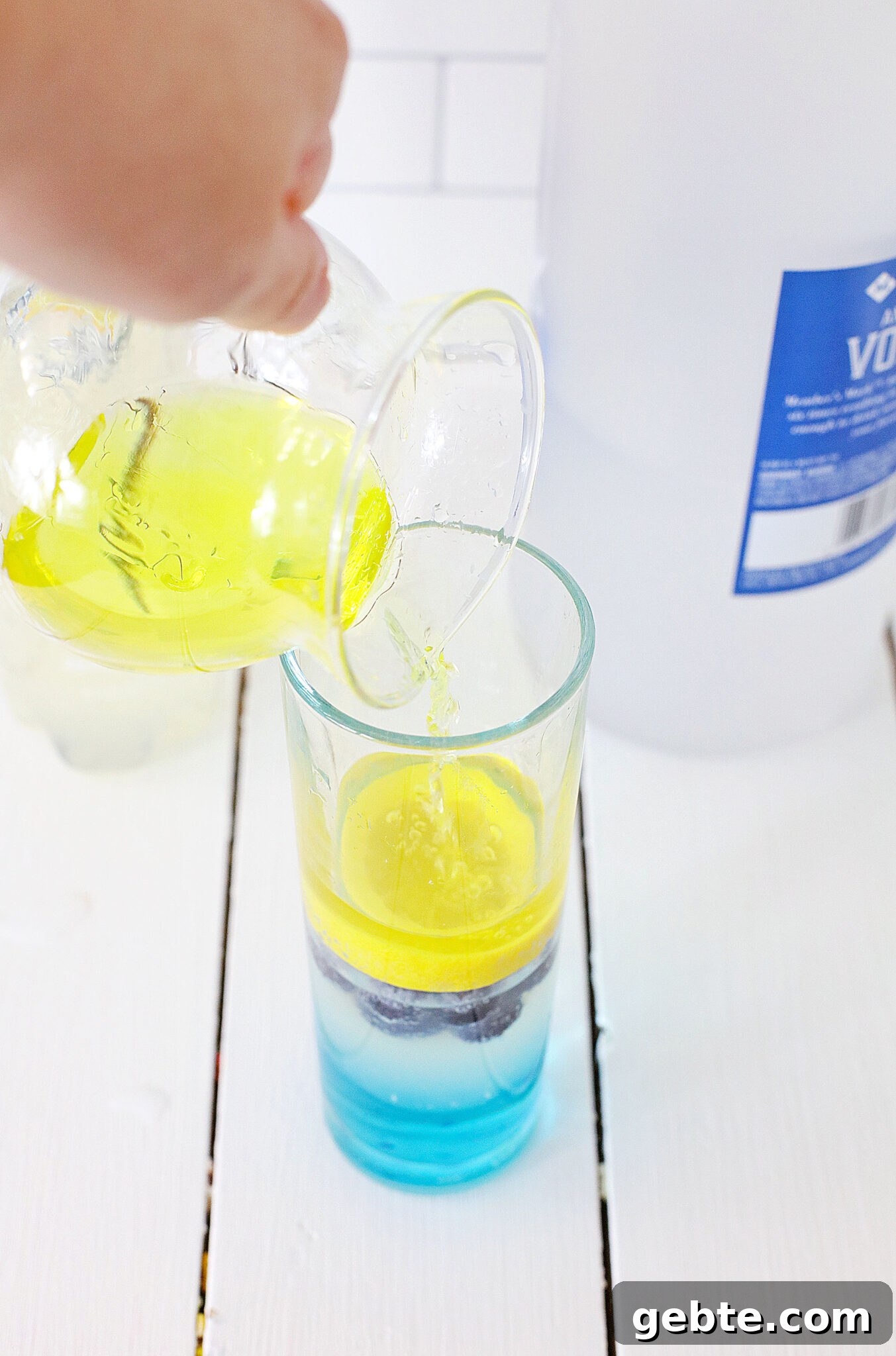 Blueberry Vodka Lemonade Recipe: Refreshing Summer Cocktail 11 Vodka being added to the glass