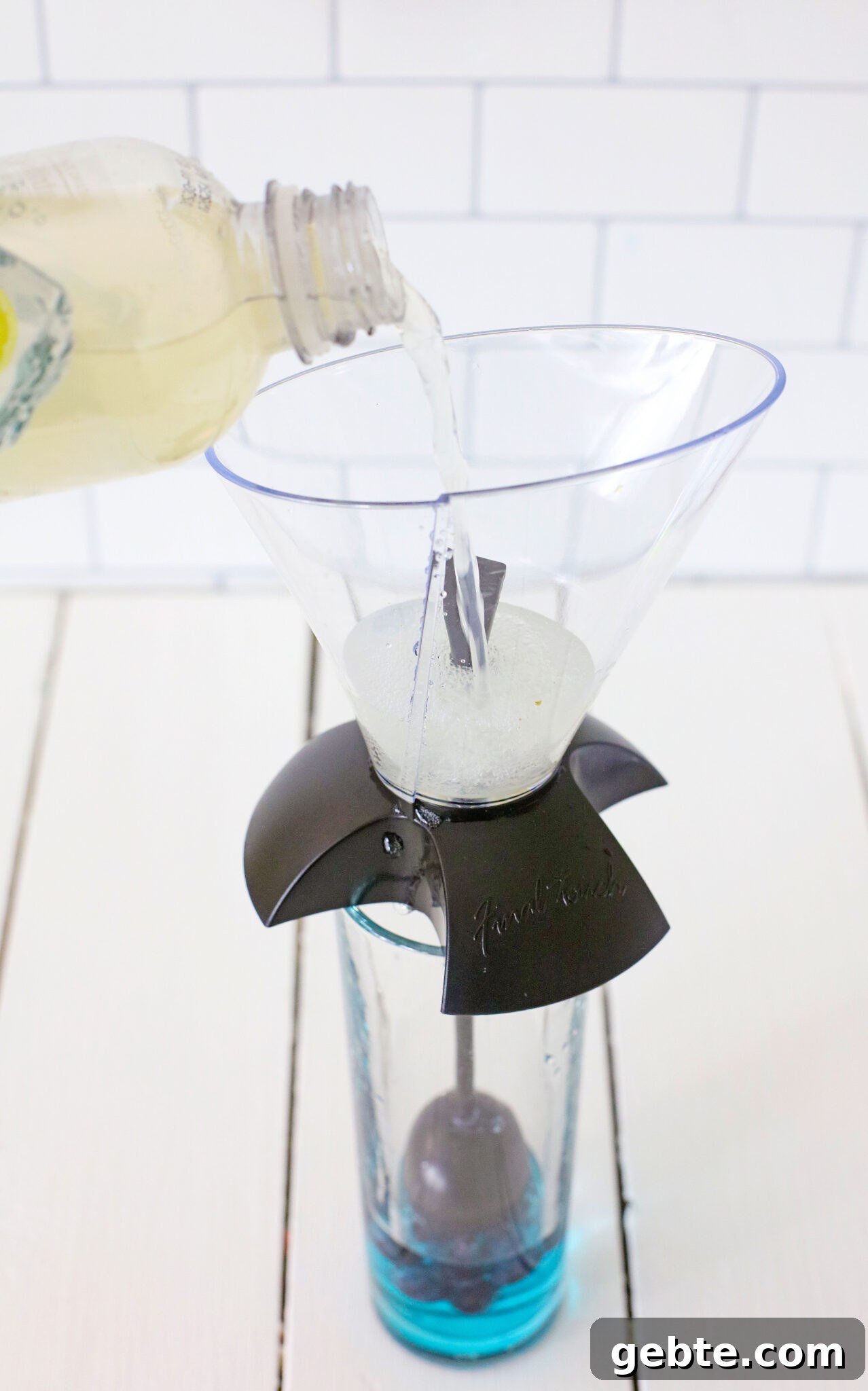 Blueberry Vodka Lemonade Recipe: Refreshing Summer Cocktail 9 Lemonade being added to glass