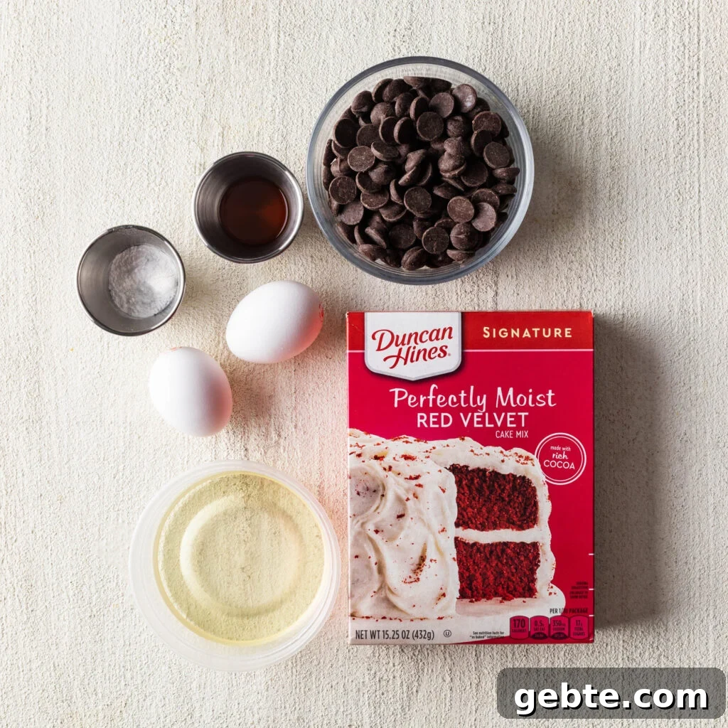 Red Velvet Cake Mix Cookies: Soft, Chewy Cookie Recipe 3 red velvet cake mix cookies ingredients. duncan hines perfectly moist red velvet cake mix, oil, two eggs, chocolate chips, baking powder, and vanilla extract