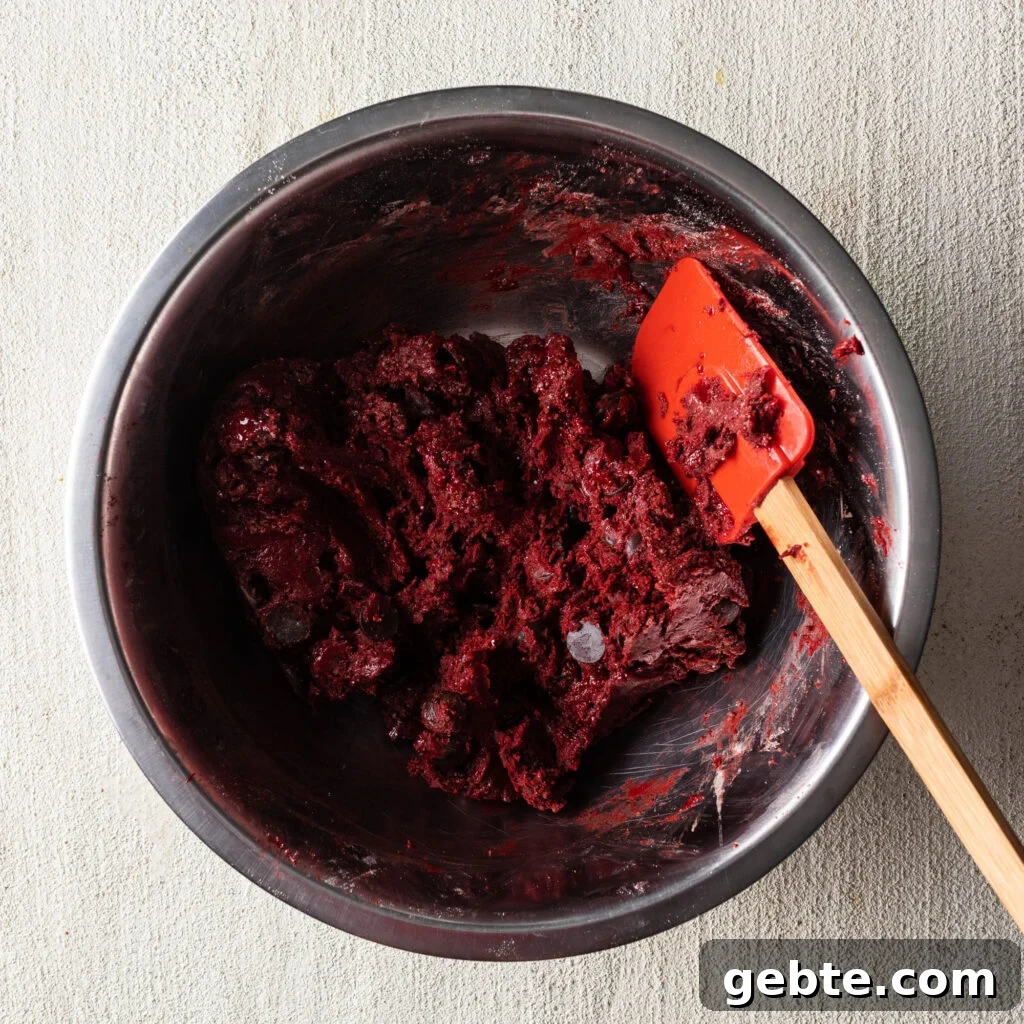 Red Velvet Cake Mix Cookies: Soft, Chewy Cookie Recipe 6 red velvet cake mix cookie dough in a bowl with a spatula